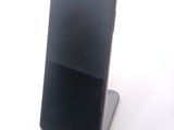 a cell phone that is sitting on top of a stand