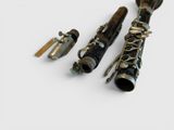 three different types of musical instruments on a white surface