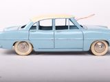 a toy car with a surfboard on top of it