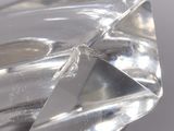 a close up of a clear glass object on a table