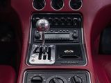 the interior of a car with a red leather seat and dashboard