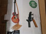 a cardboard box with a guitar and other musical instruments on it