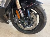 a close up of a motorcycle parked in a garage