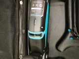 a black case with a blue handle and a black and blue device in it