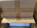 several cardboard boxes stacked on top of each other in a warehouse