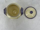 a yellow and blue tea pot and a blue and white tea pot