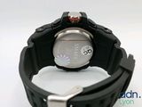 a close up of a wrist watch on a white surface
