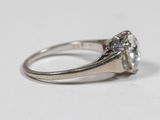 an image of a diamond ring on a white surface