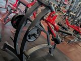 a gym with a lot of machines in the room