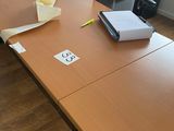a wooden table with a piece of paper on top of it