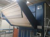 a large blue machine that is inside of a building