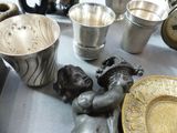 a table with a lot of silver items on it