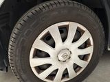 a white car that has a flat tire on it
