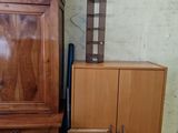 a wooden cabinet and a cabinet with a clock on it