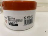 a close up of a jar of cream on a counter