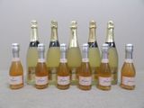 six bottles of champagne are lined up in a row on a table