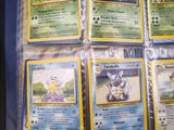 a lot of pokemon cards in the bag on the table