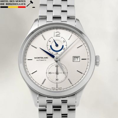 a close up of a silver watch with a blue second hand