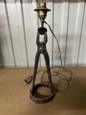 a lamp that is sitting on a table next to a lamp