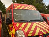 two red and yellow vans parked next to each other