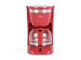 une cafetière rouge posée sur un plan de travail blanc