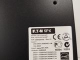a close up of the back of a black box with a white sticker on it