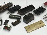 many different types of toy trains on a white surface