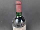 a bottle of wine that is sitting on a table
