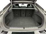 a trunk of a car with the back seats folded down