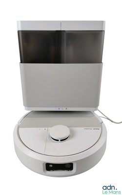 an image of a white roombake with a tv on top