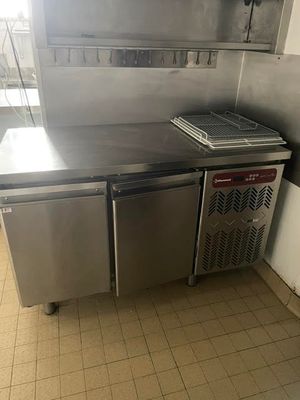 a stainless steel kitchen with a stove and a dishwasher