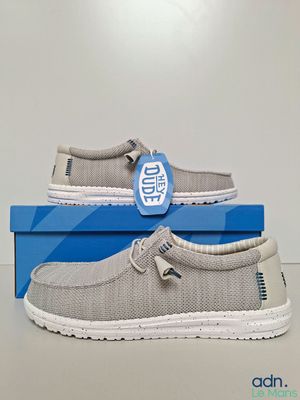 men ' s slip on shoes in grey with white soles