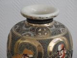 a vase with a picture of a man and a woman on it