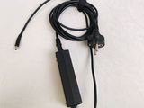a cord that is connected to a charger on a table