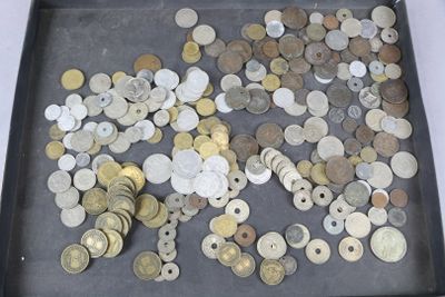 a lot of coins in a black box on a table