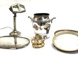 a lot of silver items that are on the table