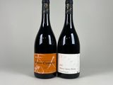 deux bouteilles de vin posées l'une à côté de l'autre sur une table