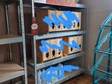 many shelves with boxes on them in a room