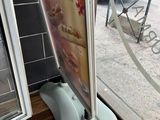 a picture of a sign in front of a window