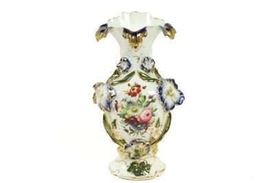 a white vase with a floral design on it