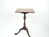 an image of a small table with a wooden top on a white background