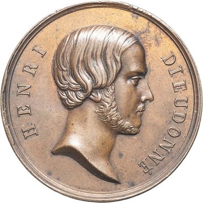 an old coin with a man ' s face on it
