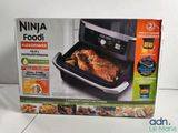 the box of the ninja foodi air fryer is on the table