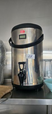 a coffee maker and cups on a shelf in a kitchen