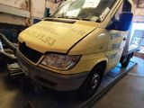 a van that is being worked on in a garage