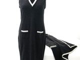 a dress on a mannequin stand with a scarf