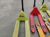 three forklifts sitting on top of each other in a warehouse