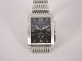 a close up of a wrist watch on a white surface