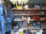 a small room with a lot of tools on the shelves