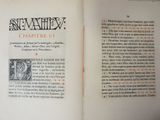 an open book with a picture of a man on it